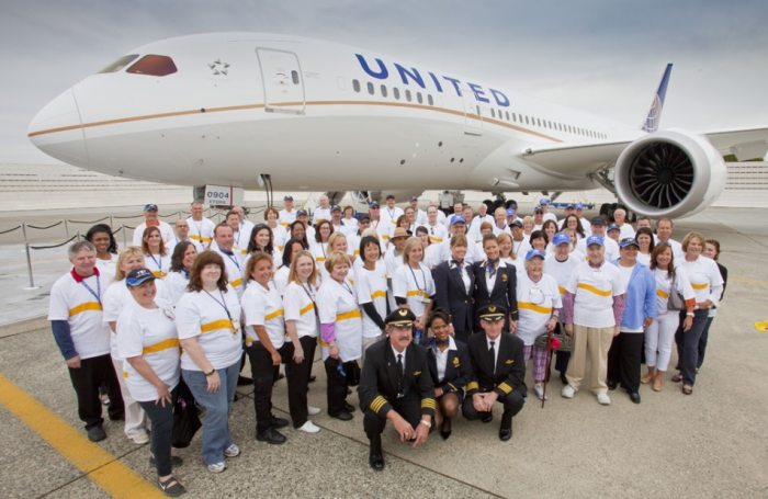 United Airlines staff in front of an aircraft